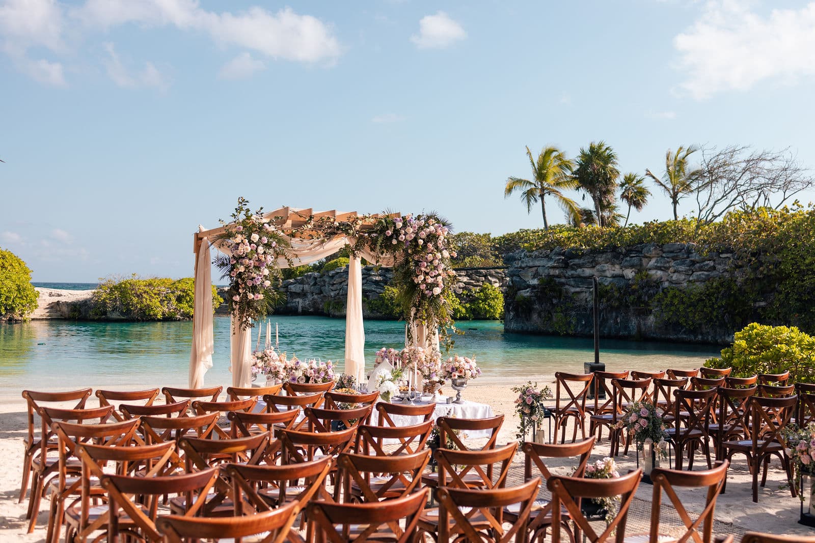 Wedding ceremony set up on the sand of the cove